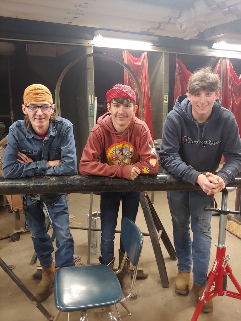 Three boys welding